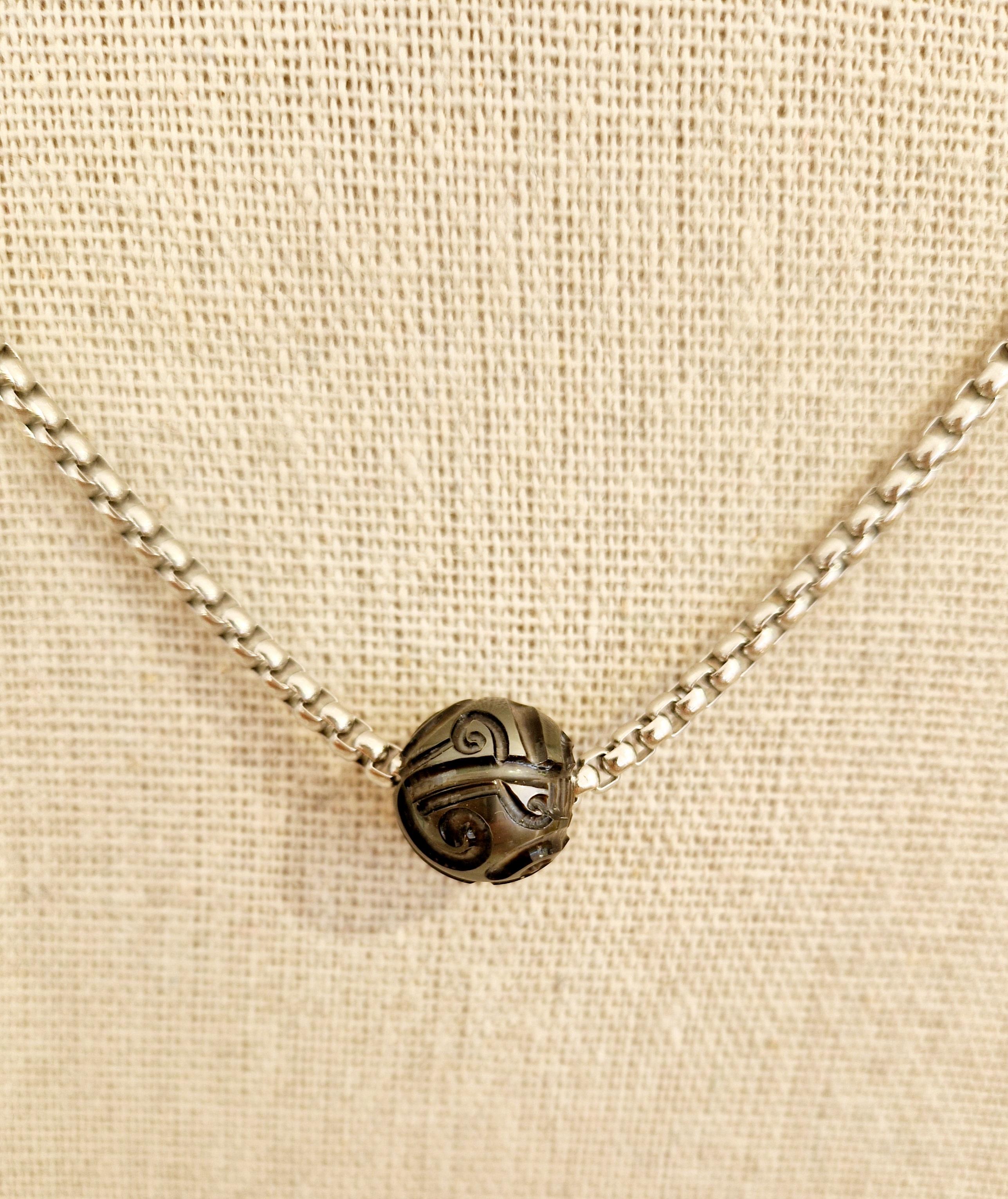collier en acier avec perle noire de tahiti